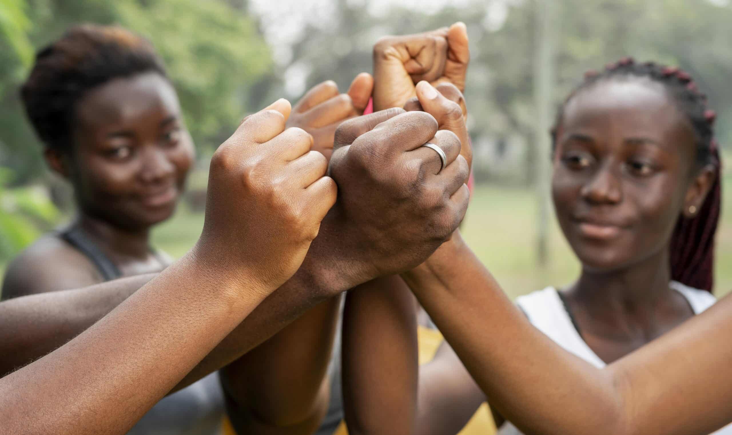 Image of girls holdign hands together